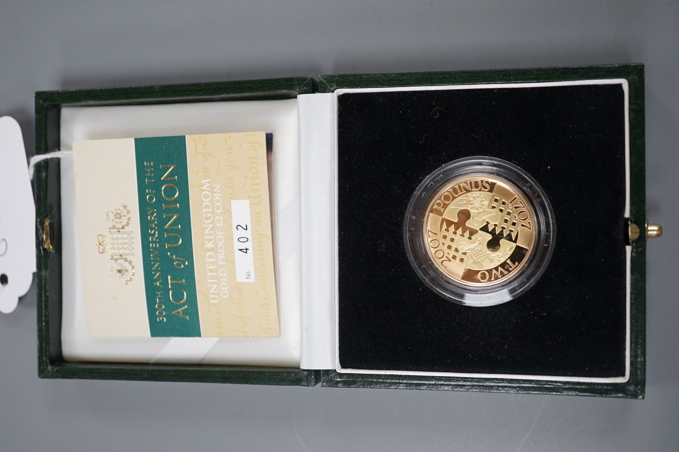 A cased Limited Edition 2002 '300th Anniversary of the Act of the Union', gold £2 proof coin, with certificate.